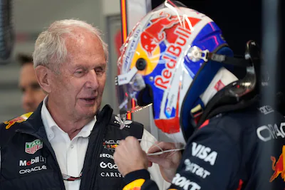 former-driver-helmut-marko-talks-with-red-bull-driver-max-verstappen-during-the-first-qualifying-ses.webp