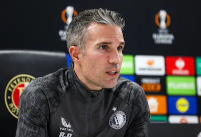 rotterdam-netherlands-november-26-feyenoord-head-coach-robin-van-persie-during-a-feyenoord-md-1-pres.webp