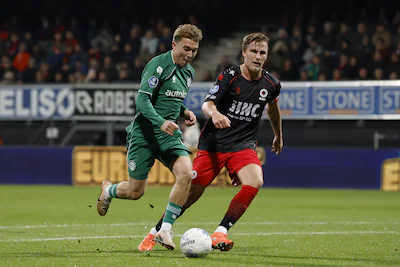2025-12-05-20-13-19-rotterdam-l-r-jorg-schreuders-of-fc-groningen-casper-widell-of-sbv-excelsior-rot.webp