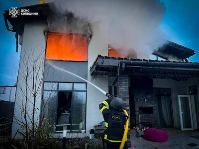 a-firefighter-works-at-the-site-of-a-house-heavily-damaged-during-russian-early-morning-drone-and-mi.webp