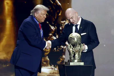 epa12572884-us-president-donald-trump-l-receives-the-fifa-peace-prize-from-fifa-president-giovanni-i.webp
