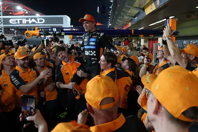 epa12577421-mclaren-driver-lando-norris-of-britain-c-is-celebrated-by-team-members-for-winning-the-2.webp