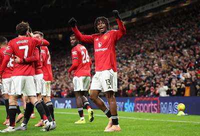 epa12613335-patrick-dorgu-of-manchester-united-celebrates-scoring-the-1-0-goal-during-the-english-pr.webp