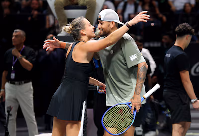 epa12615867-aryna-sabalenka-of-belarus-l-and-nick-kyrgios-of-australia-embrace-at-the-net-after-the.avif