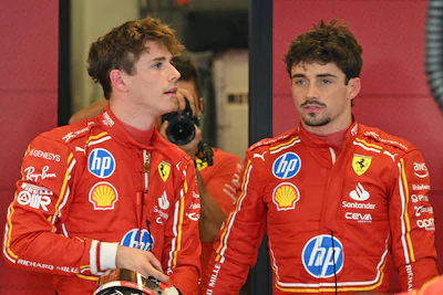 ferrari-s-monegasque-driver-charles-leclerc-r-speaks-to-his-brother-ferrari-s-reserve-driver-arthur.webp