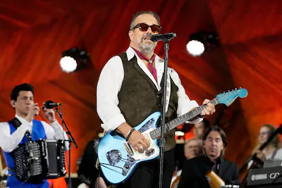 file-frontman-raul-malo-center-and-the-mavericks-perform-during-the-boston-pops-fireworks-spectacula.webp