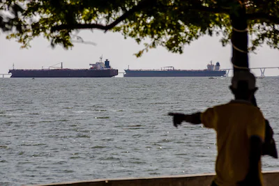 files-a-man-watches-two-crude-oil-tankers-remaining-anchored-on-lake-maracaibo-near-maracaibo-zulia.webp
