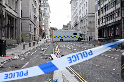 files-police-officers-stand-at-a-cordon-on-in-water-street-in-liverpool-north-west-england-on-may-27.avif