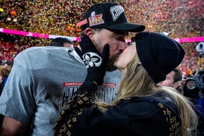 kansas-city-chiefs-tight-end-travis-kelce-and-taylor-swift-kiss-after-the-afc-championship-nfl-footb.jpeg