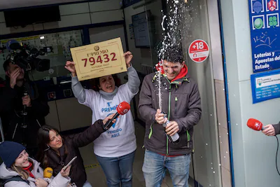 madrid-spain-december-22-owners-of-a-lottery-office-celebrate-after-the-traditional-spanish-christma.webp