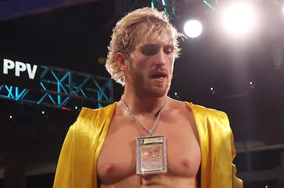 miami-gardens-florida-june-06-logan-paul-wears-a-charizard-pokemon-card-chain-as-he-enters-the-ring.webp
