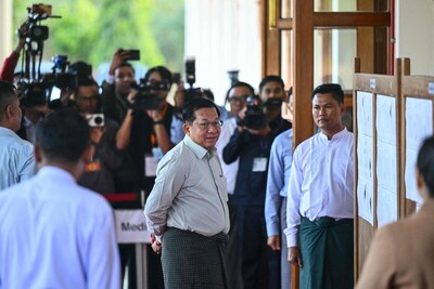 myanmar-s-junta-chief-min-aung-hlaing-c-arrives-to-vote-at-a-polling-station-during-the-first-phase.jpeg