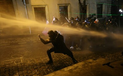 topshot-police-officers-use-water-cannons-to-desperse-demonstrators-during-clashes-as-part-of-a-prot.jpeg