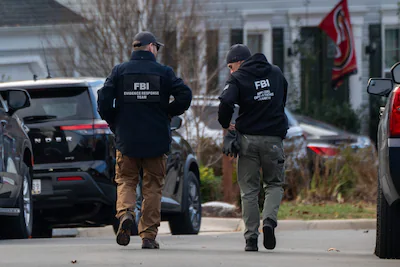 woodbridge-virginia-december-4-fbi-agents-gather-in-front-of-the-home-of-suspected-january-6th-2021.webp