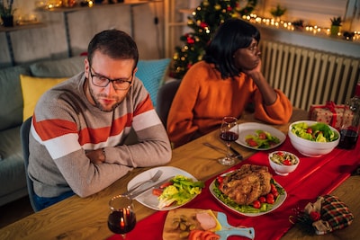young-unhappy-multi-ethnic-couple-ignoring-each-other-after-an-argument-during-christmas-dinner.jpeg