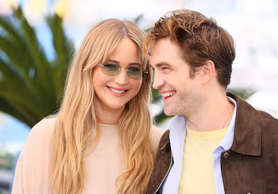 cannes-france-may-18-jennifer-lawrence-and-robert-pattinson-pose-during-the-die-my-love-photocall-at.avif