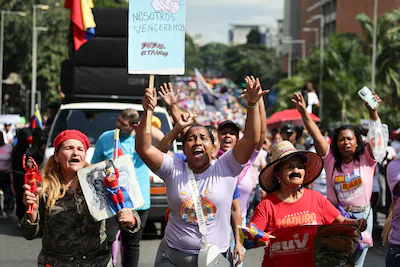 caracas-venezuela-january-6-people-march-with-a-sign-that-reads-we-will-win-doubt-is-treason-in-span.webp