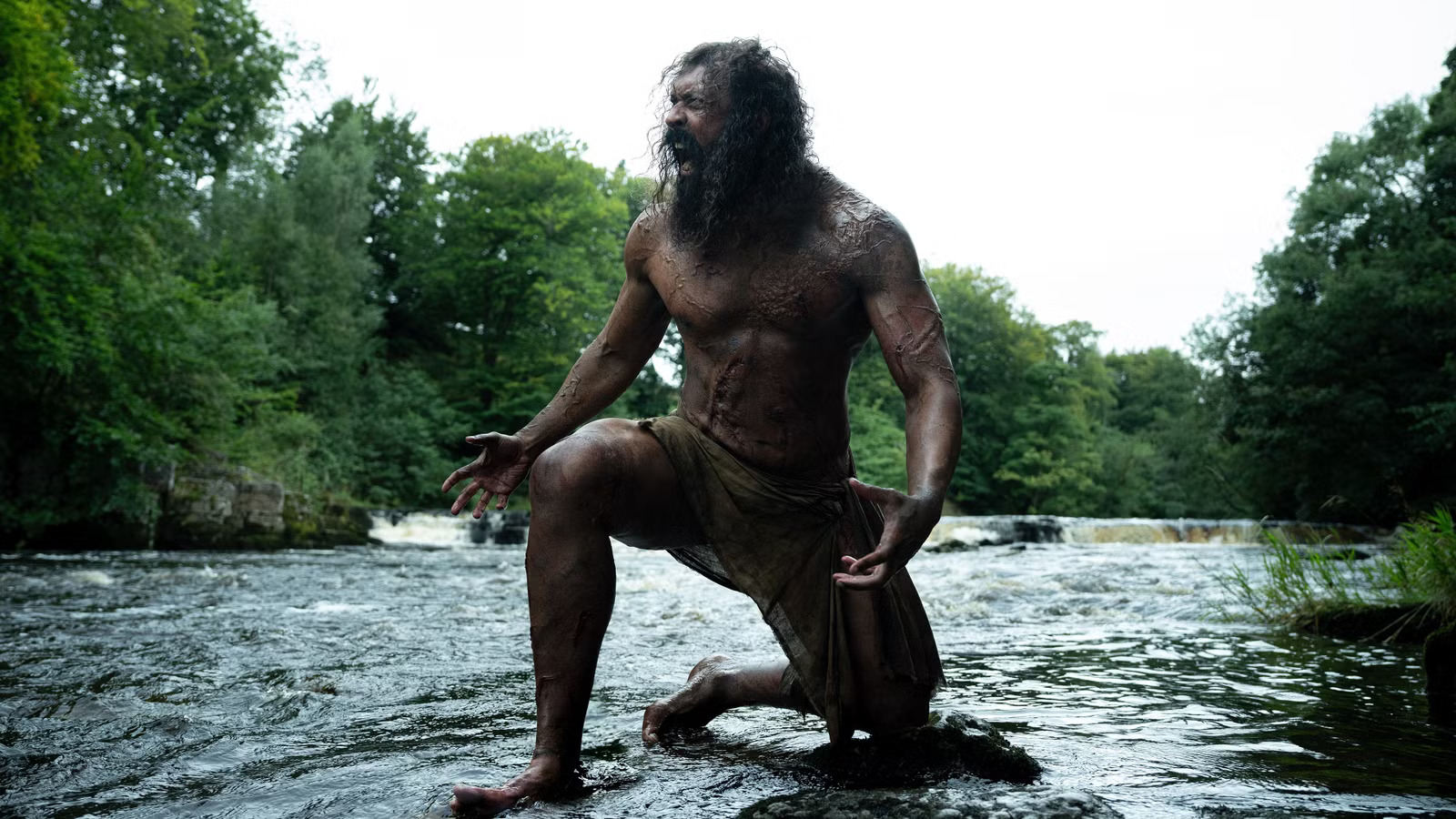 chi-lewis-parry-s-samson-roaring-while-kneeling-in-a-river-in-28-years-later-the-bone-temple.jpg