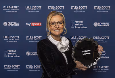 england-women-s-football-head-coach-sarina-wiegman-poses-with-her-trophy-during-fwa-s-tribute-night.avif