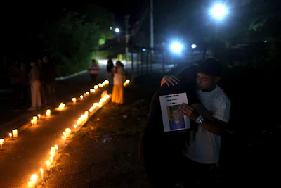 epa12650280-relatives-of-political-prisoners-embrace-during-a-vigil-outside-the-rodeo-i-prison-in-za.webp