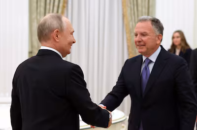 epa12672641-russian-president-vladimir-putin-l-shakes-hands-with-us-presidential-envoy-steve-witkoff.avif