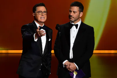 files-stephen-colbert-l-and-jimmy-kimmel-speak-onstage-during-the-71st-emmy-awards-at-the-microsoft.webp
