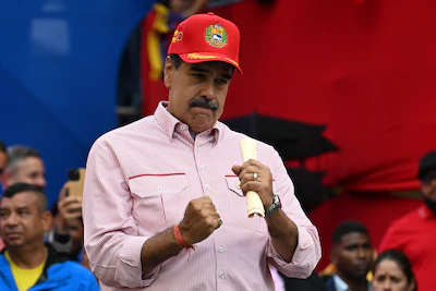 files-venezuela-s-president-nicolas-maduro-dances-during-a-rally-in-caracas-on-december-1-2025-in-an.webp