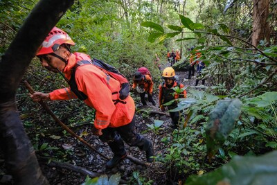 joint-search-and-rescue-teams-climb-towards-the-suspected-crash-site-of-an-indonesia-air-transport-t.jpeg