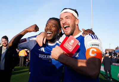 macclesfield-fc-goalscorers-paul-dawson-right-and-isaac-buckley-ricketts-celebrate-following-the-fa.webp