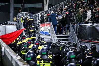 picture-shows-an-altercation-between-dutch-police-and-krc-genk-supporters-ahead-of-a-soccer-game-bet.webp