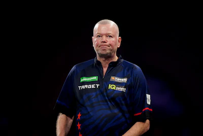 raymond-van-barneveld-reacts-after-losing-his-match-against-stefan-bellmont-on-day-seven-of-the-padd.webp