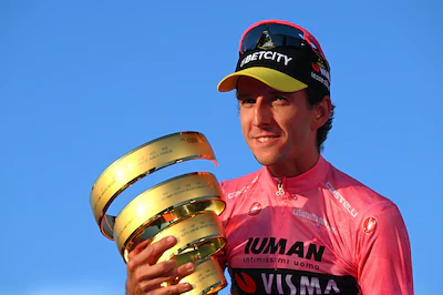 rome-italy-june-01-simon-yates-of-great-britain-and-team-visma-lease-a-bike-celebrates-at-podium-as.webp