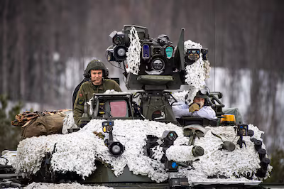 soldiers-from-the-norwegian-armed-forces-operate-a-tank-as-they-participate-in-the-international-mil.avif