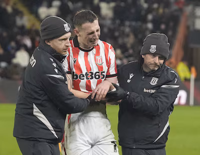 stoke-city-s-robert-bozenik-is-helped-from-the-pitch-after-receiving-medical-treatment-for-an-injury.avif