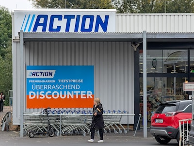 the-exterior-view-of-the-action-discount-store-shows-shoppers-with-shopping-carts-in-alsfeld-germany.jpeg