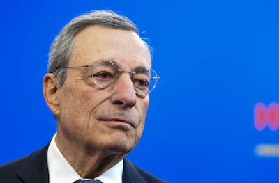 files-former-italian-prime-minister-and-economist-mario-draghi-gives-a-statement-as-he-arrives-to-at.webp