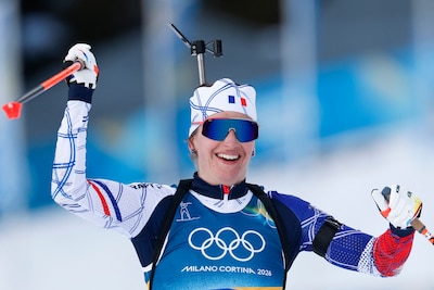 france-s-julia-simon-celebrates-as-she-crosses-the-finish-line-for-france-to-win-gold-in-the-mixed-b.jpeg
