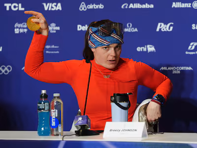 gold-medallist-usa-s-breezy-johnson-shows-her-broken-medal-to-the-media-following-the-women-s-alpine.avif