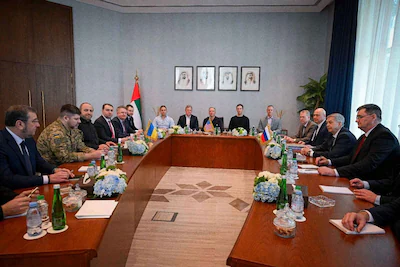 the-members-of-delegations-participating-in-the-uae-hosted-trilateral-talks-between-the-u-s-russia-a.webp